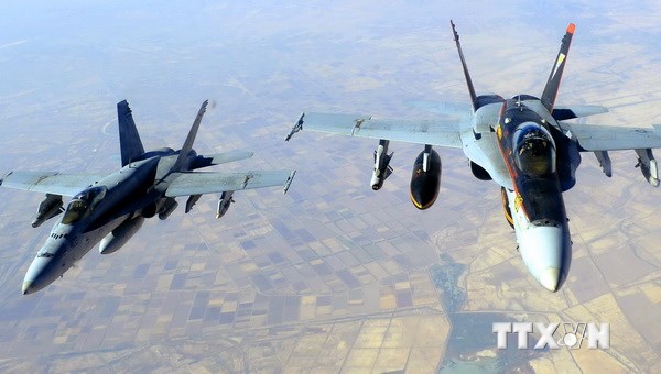Máy bay chiến đấu F/A-18E Super Hornet tham gia chiến dịch không kích vào các mục tiêu của IS tại Syria và Iraq. (Nguồn: AFP/TTXVN)