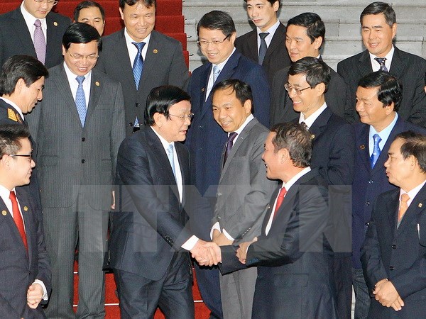 Chủ tịch nước Trương Tấn Sang với đại diện các Doanh nghiệp đạt Thương hiệu quốc gia năm 2014. (Ảnh: Nguyễn Khang/TTXVN)