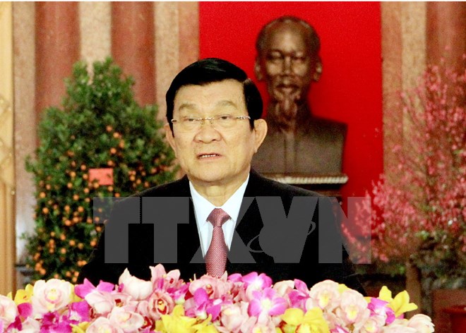 Chủ tịch nước Trương Tấn Sang đọc thư chúc Tết Ất Mùi 2015. (Ảnh: Nguyễn Khang/TTXVN)