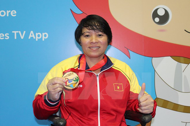 ​Vận động viên cử tạ Châu Hoàng Tuyết Loan đã mang về huy chương vàng cho đoàn thể thao Việt Nam.(Ảnh: Lê Hải-Việt Hải/TTXVN)