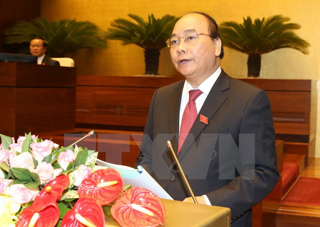 Thủ tướng Nguyễn Xuân Phúc trình bày báo cáo trước Quốc hội sáng 29-7. (Ảnh: Thống Nhất/TTXVN)