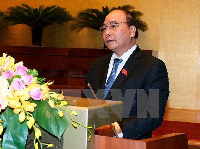 Thủ tướng Chính phủ Nguyễn Xuân Phúc trình bày báo cáo của Chính phủ trước Quốc hội. (Ảnh: Thống Nhất/TTXVN)