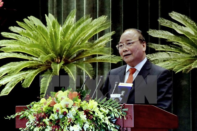 Thủ tướng Nguyễn Xuân Phúc đến dự và phát biểu tại Hội nghị Người Việt Nam ở nước ngoài trên thế giới năm 2016. (Ảnh: Thế Anh/TTXVN)