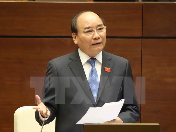 Thủ tướng Chính phủ Nguyễn Xuân Phúc trả lời chất vấn các đại biểu Quốc hội. (Ảnh: Phương Hoa/TTXVN)