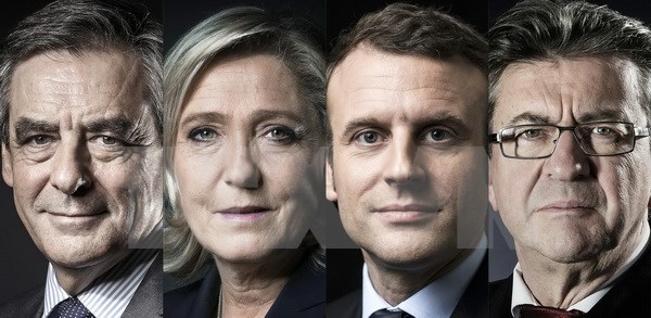 Áp phích đăng chân dung các viên tranh cử Tổng thống Pháp (từ trái sang): Francois Fillon, Marine Le Pen, Emmanuel Macron và Jean-Luc Melenchon. (Nguồn: AFP/ TTXVN)
