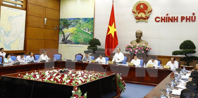Thủ tướng Nguyễn Xuân Phúc, Chủ tịch Ủy ban Quốc gia về biến đổi khí hậu chủ trì cuộc họp lần thứ 8 về biến đổi khí hậu. (Ảnh: Thống Nhất/TTXVN)