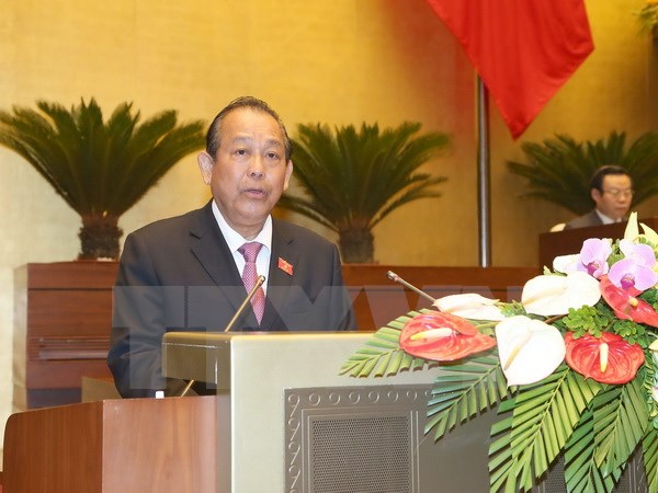 Phó Thủ tướng Thường trực Chính phủ Trương Hòa Bình trình bày Báo cáo. (Ảnh: Doãn Tấn/TTXVN)