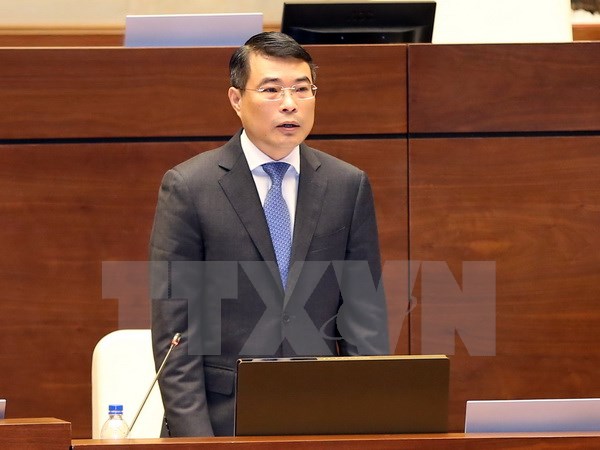 Thống đốc Ngân hàng Nhà nước Việt Nam Lê Minh Hưng giải trình ý kiến của đại biểu Quốc hội. (Ảnh: Doãn Tấn/TTXVN)