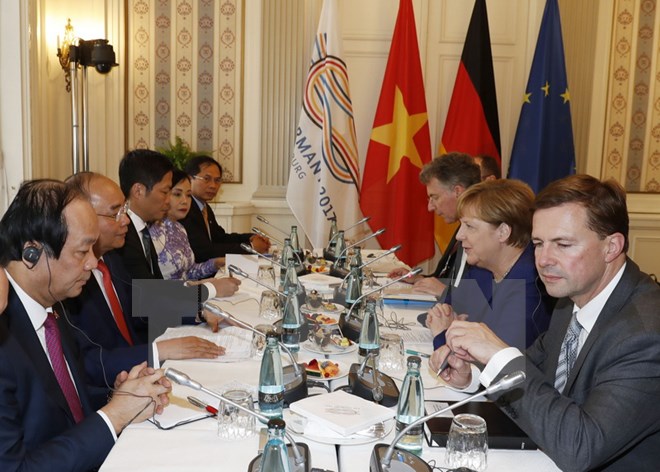 Thủ tướng Nguyễn Xuân Phúc hội đàm với Thủ tướng Đức Angela Merkel. (Ảnh: Thống Nhất/TTXVN)