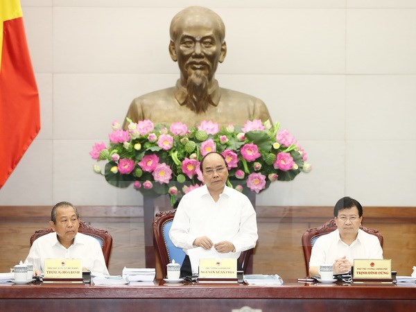 Thủ tướng Nguyễn Xuân Phúc chủ trì Phiên họp chuyên đề của Chính phủ về xây dựng pháp luật. (Ảnh: Thống Nhất/TTXVN)