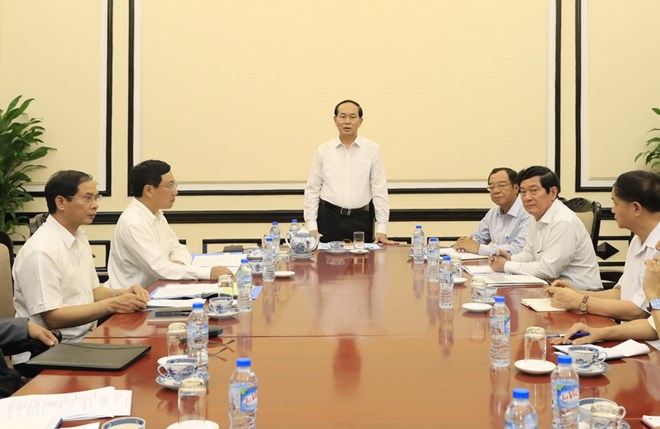 Chủ tịch nước Trần Đại Quang làm việc với lãnh đạo Ủy ban Quốc gia APEC 2017 về công tác chuẩn bị Tuần lễ Cấp cao APEC 2017. (Ảnh: Nhan Sáng/TTXVN)