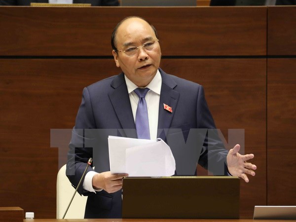 Thủ tướng Nguyễn Xuân Phúc trả lời chất vấn của đại biểu Quốc hội. (Ảnh: Phương Hoa/TTXVN)