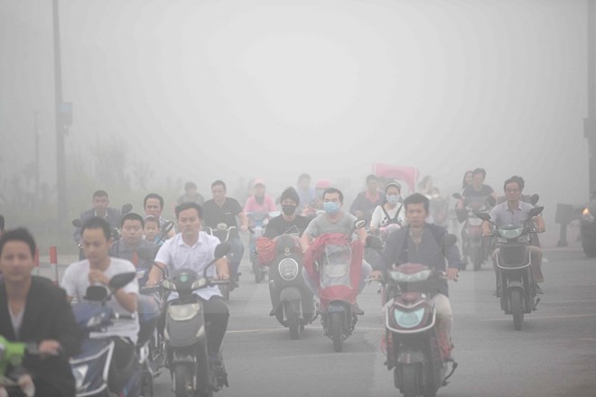Khói mù ô nhiễm bao phủ khu vực Hàng Châu, tỉnh Chiết Giang, Trung Quốc ngày 26/9. (Nguồn: AFP/TTXVN)