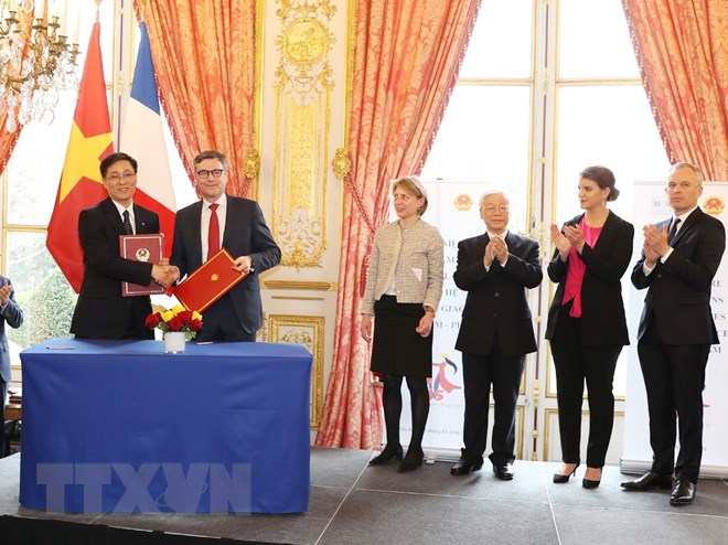 Lễ ký Chương trình hợp tác năm 2018 giữa Bộ Tư pháp Việt Nam và Hội đồng Công chứng tối cao Pháp. (Ảnh: Trí Dũng/TTXVN)