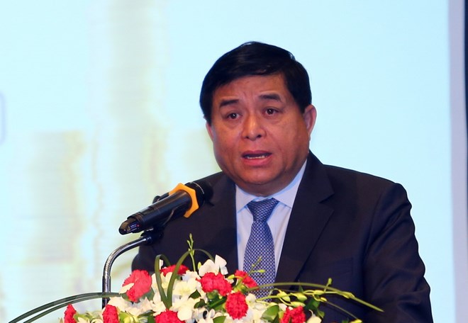 Ông Nguyễn Chí Dũng, Bộ Trưởng Bộ Kế hoạch và Đầu tư phát biểu và trả lời một số câu hỏi của các nhà đầu tư tại hội thảo. (Ảnh: Danh Lam/TTXVN)