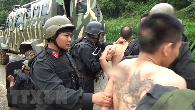Bắt giữ tội phạm ma túy ở Lóng Luông, Sơn La. (Nguồn: TTXVN phát)