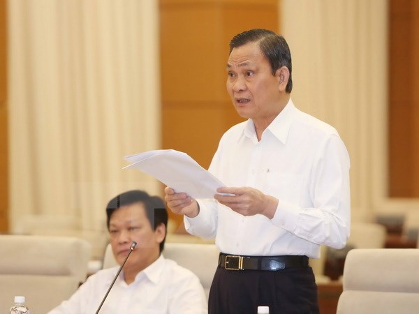 Bộ trưởng Bộ Nội vụ Nguyễn Thái Bình trình bày tờ trình. (Ảnh: Phương Hoa/TTXVN)