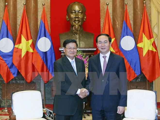 Chủ tịch nước Trần Đại Quang tiếp Thủ tướng Chính phủ Lào Thongloun Sisoulith đang thăm hữu nghị chính thức Việt Nam. (Ảnh: Nhan Sáng-TTXVN)