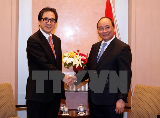 Thủ tướng Nguyễn Xuân Phúc tiếp ông Hiroyuki Ishige, Chủ tịch Cơ quan Xúc tiến Thương mại Nhật Bản (JETRO). (Ảnh: Thống Nhất/TTXVN)