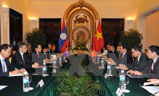 Phó Thủ tướng, Bộ trưởng ngoại giao Phạm Bình Minh hội đàm với Bộ trưởng Ngoại giao Lào, Saleumxay Kommasith. (Ảnh: Nguyễn Khang/TTXVN)