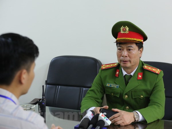 Đại tá Phùng Đức Quang, Phó Giám đốc Công an tỉnh Phú Thọ trả lời phỏng vấn sau phiên tòa. (Ảnh: Xuân Tùng/Vietnam+)