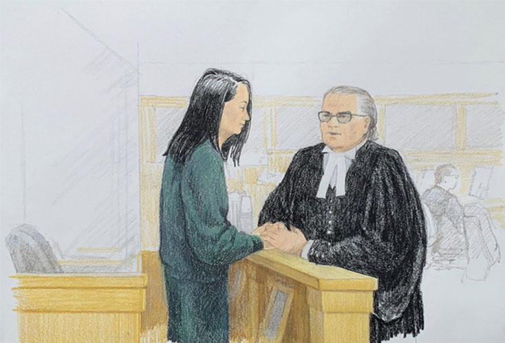 Bà Meng Wanzhou, giám đốc tài chính Huawei trao đổi với luật sư David Martin tại tòa ở Vancouver, British Columbia, Canada ngày 10-12 - Ảnh: AFP