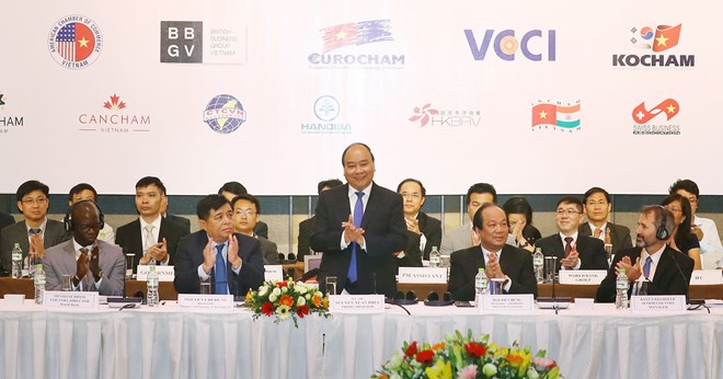 Thủ tướng Nguyễn Xuân Phúc tại Diễn đàn Doanh nghiệp Việt Nam thường niên năm 2018. (Ảnh: Thống Nhất/TTXVN)
