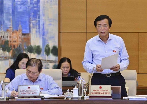 Tổng Thư ký Quốc hội Nguyễn Hạnh Phúc trình bày Tờ trình về việc chuẩn bị Kỳ họp thứ 8 của Quốc hội. (Ảnh: Văn Điệp/TTXVN)