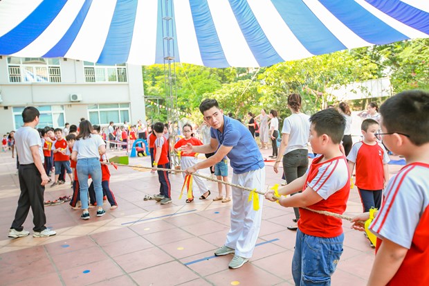 Học sinh tham gia ngày hội thể dục thể thao để thúc đẩy các hoạt động tăng cường thể lực. (Ảnh: PV/Vietnam+)