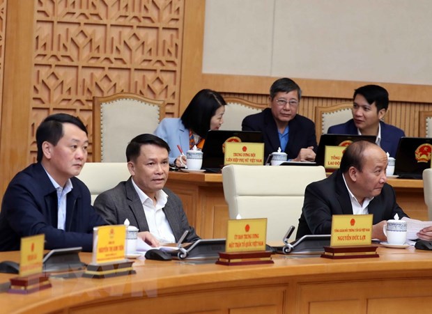 Lãnh đạo các bộ, cơ quan ngang bộ, cơ quan trực thuộc Chính phủ, Ủy ban Mặt trận Tổ quốc Việt Nam dự phiên họp. (Ảnh: Thống Nhất/TTXVN)