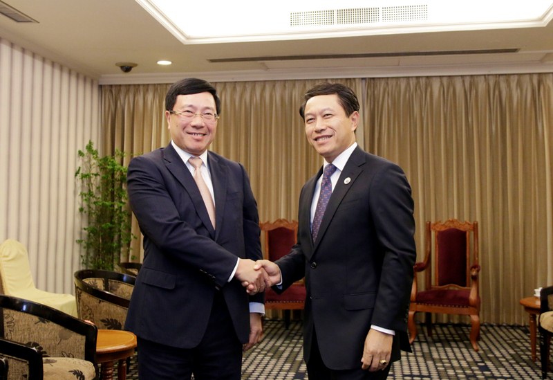 Phó Thủ tướng, Bộ trưởng Ngoại giao Phạm Bình Minh và Bộ trưởng Ngoại giao Lào Saleumxay Kommasith. Ảnh: VGP