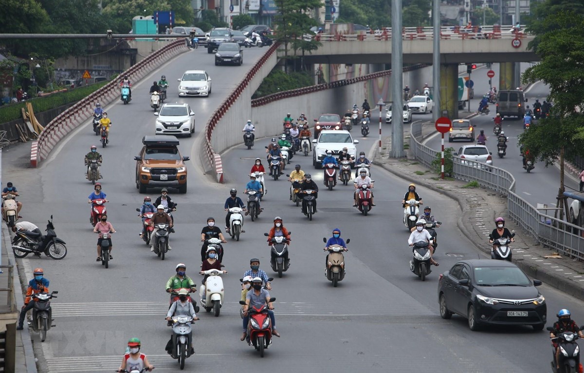 Nới lỏng gian giãn cách xã hội nhưng phải đảm bảo các quy định phòng chống dịch CIVID-19. (Ảnh: Minh Quyết/TTXVN)