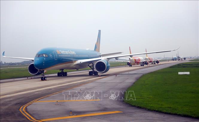 Máy bay của các hãng hàng không tại sân bay Nội Bài. Ảnh: Huy Hùng/TTXVN