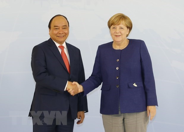 Thủ tướng Đức Angela Merkel và Thủ tướng Nguyễn Xuân Phúc. (Ảnh: Thống Nhất/TTXVN)