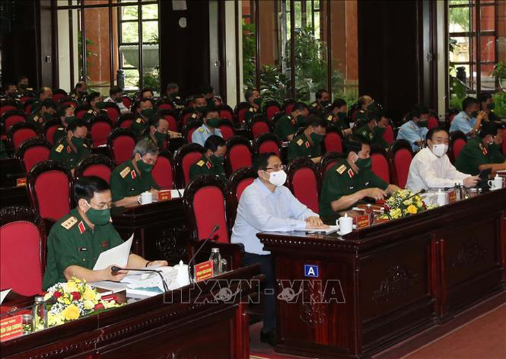 Thủ tướng Phạm Minh Chính dự Hội nghị Quân chính toàn quân 6 tháng đầu năm 2021. Ảnh: Trọng Đức/ TTXVN