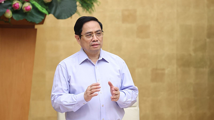 Thủ tướng Phạm Minh Chính yêu cầu rà soát pháp luật, tháo gỡ khó khăn cho đầu tư, kinh doanh trong điều kiện dịch COVID-19. Ảnh: TTXVN 