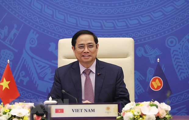 Thủ tướng Phạm Minh Chính dự Hội nghị cấp cao ASEAN-Ấn Độ lần thứ 18 theo hình thức trực tuyến tại điểm cầu Hà Nội. (Ảnh: Dương Giang/TTXVN) .