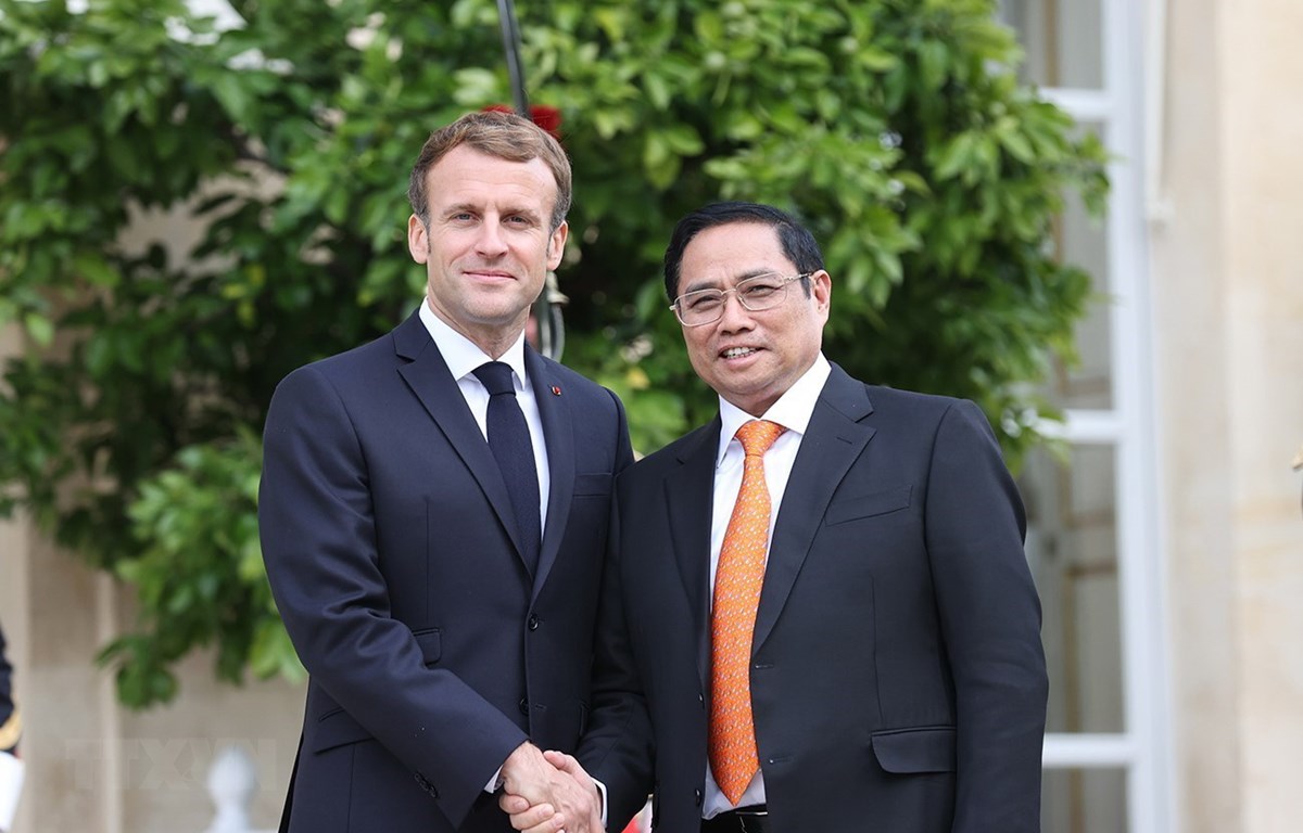 Thủ tướng Chính phủ Phạm Minh Chính và Tổng thống Cộng hòa Pháp Emmanuel Macron. (Ảnh: Dương Giang/TTXVN)