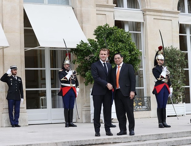 Thủ tướng Chính phủ Phạm Minh Chính và Tổng thống Cộng hòa Pháp Emmanuel Macron. (Ảnh: Dương Giang/TTXVN)