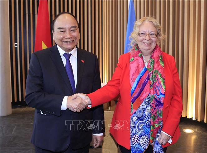 Chủ tịch nước Nguyễn Xuân Phúc gặp Tổng giám đốc Văn phòng Liên hợp quốc tại Geneve, bà Tatiana Valovaya. (Ảnh: Thống Nhất/TTXVN)