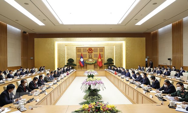 Quang cảnh buổi hội đàm giữa Thủ tướng Phạm Minh Chính và Thủ tướng Lào Phankham Viphavanh. (Ảnh: Dương Giang/TTXVN)