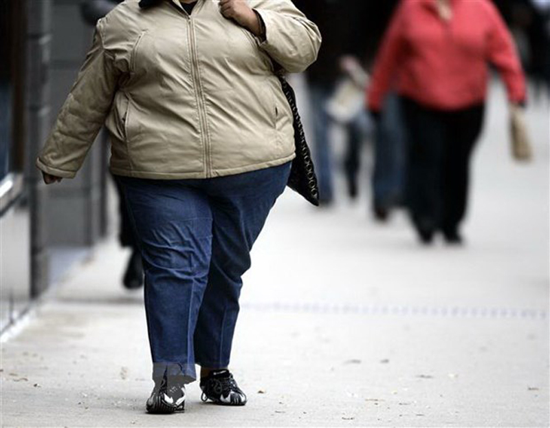 Một phụ nữ bị mắc bệnh béo phì. (Ảnh: AFP/TTXVN)