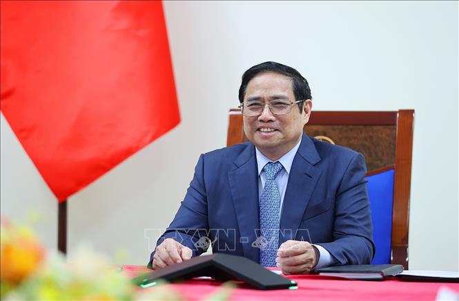 Thủ tướng Phạm Minh Chính điện đàm với Thủ tướng Lào Phankham Viphavan. Ảnh: Dương Giang/TTXVN
