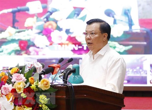 Bí thư Thành ủy Hà Nội Đinh Tiến Dũng trình bày Nghị quyết của Bộ Chính trị về phương hướng, nhiệm vụ phát triển Thủ đô Hà Nội đến năm 2030, tầm nhìn 2045. (Ảnh: Phương Hoa/TTXVN)
