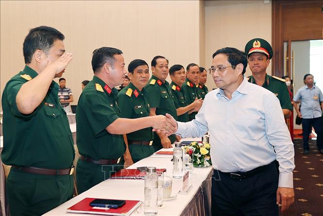 Thủ tướng Phạm Minh Chính đến dự buổi gặp mặt đại diện các đội tìm kiếm, quy tập hài cốt liệt sĩ. Ảnh: Dương Giang/TTXVN
