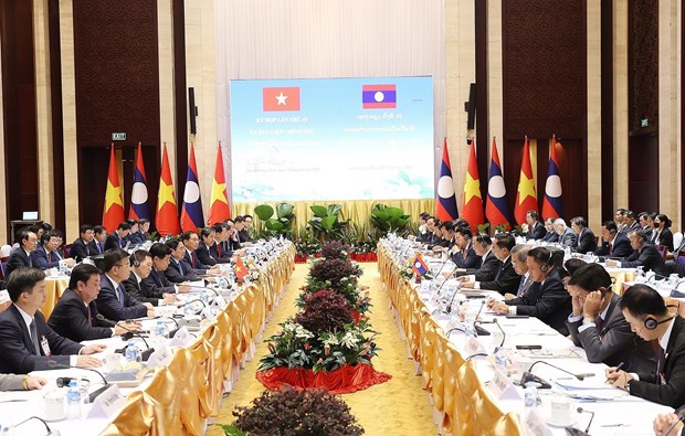 Thủ tướng Phạm Minh Chính và Thủ tướng Lào Sonexay Siphandone đồng chủ trì kỳ họp. (Ảnh: Dương Giang/TTXVN)