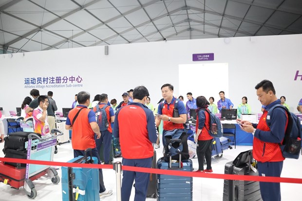 Đoàn Thể thao Việt Nam chuẩn bị nhập Làng VĐV ASIAD 19. (Ảnh: Hoàng Linh/TTXVN)