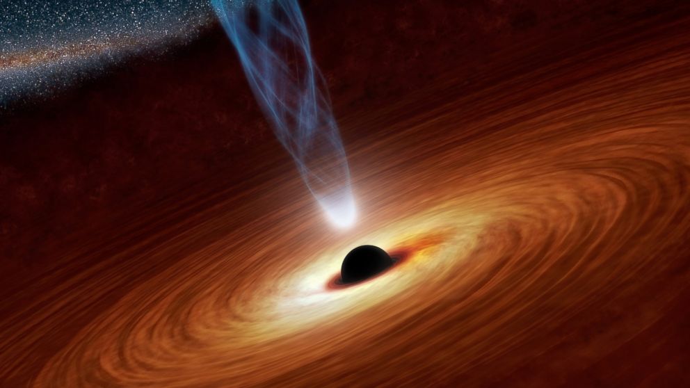 Hình minh họa do NASA công bố ngày 21/2/2013 cho thấy một lỗ đen siêu lớn trong thiên hà xoắn ốc NGC 1365. Ảnh: AP