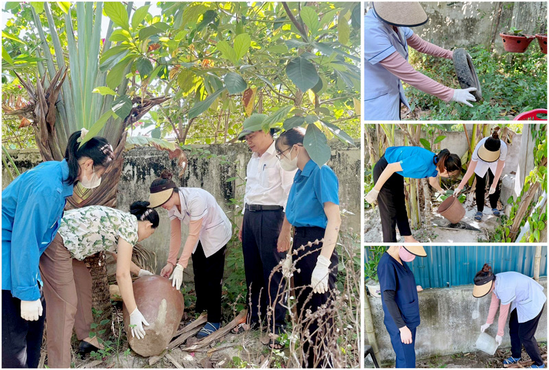 Cán bộ y tế huyện Quảng Trạch hướng dẫn người dân tìm diệt môi trường phát triển của muỗi. 